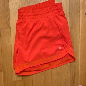 Bright red athleta shorts with mesh